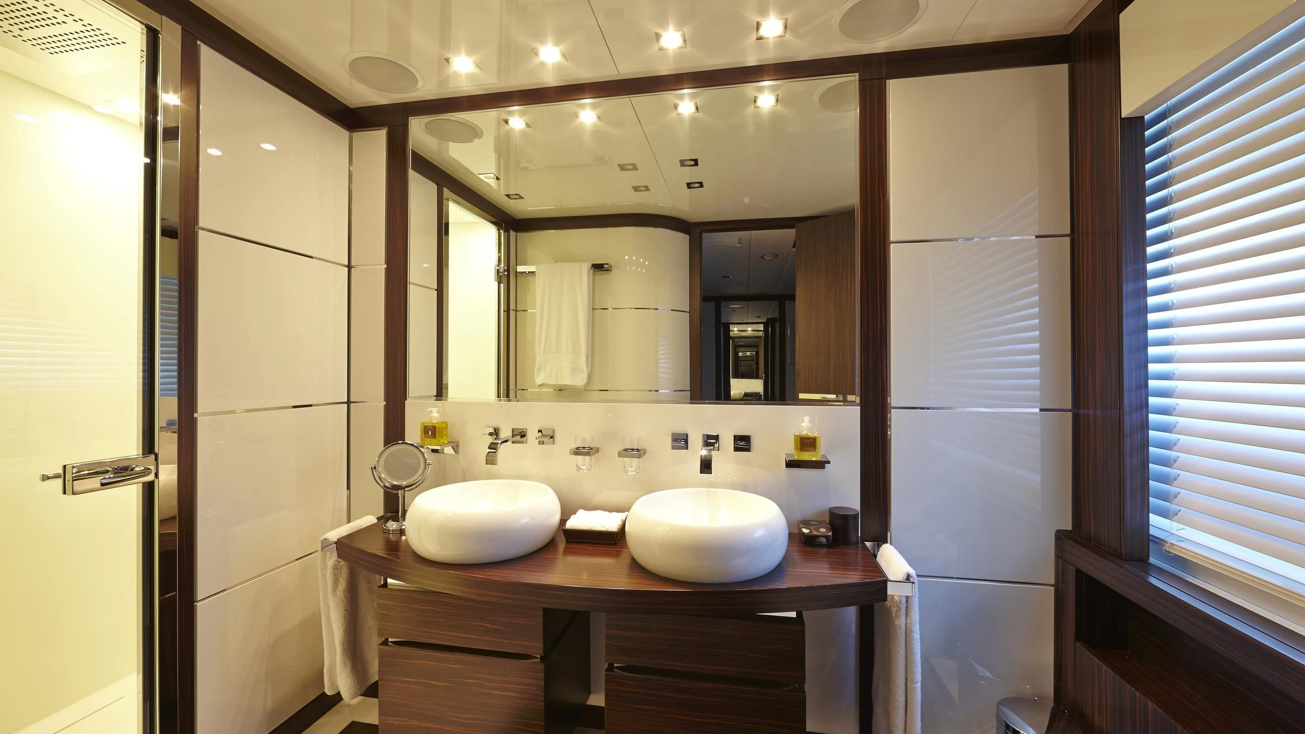 a bathroom with a large mirror aboard ANTELOPE III Yacht for Sale