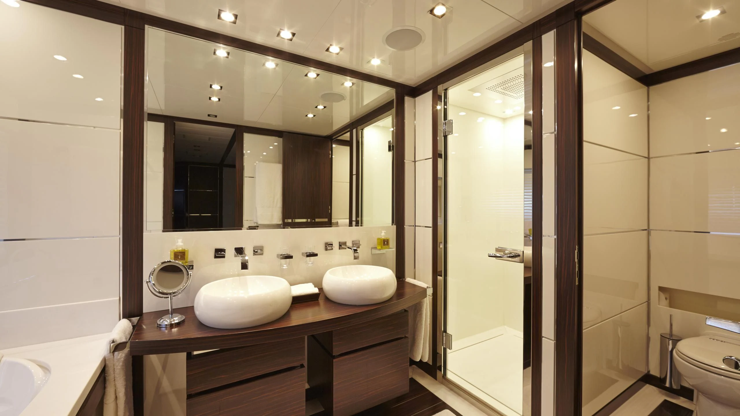 a bathroom with a large mirror aboard ANTELOPE III Yacht for Sale