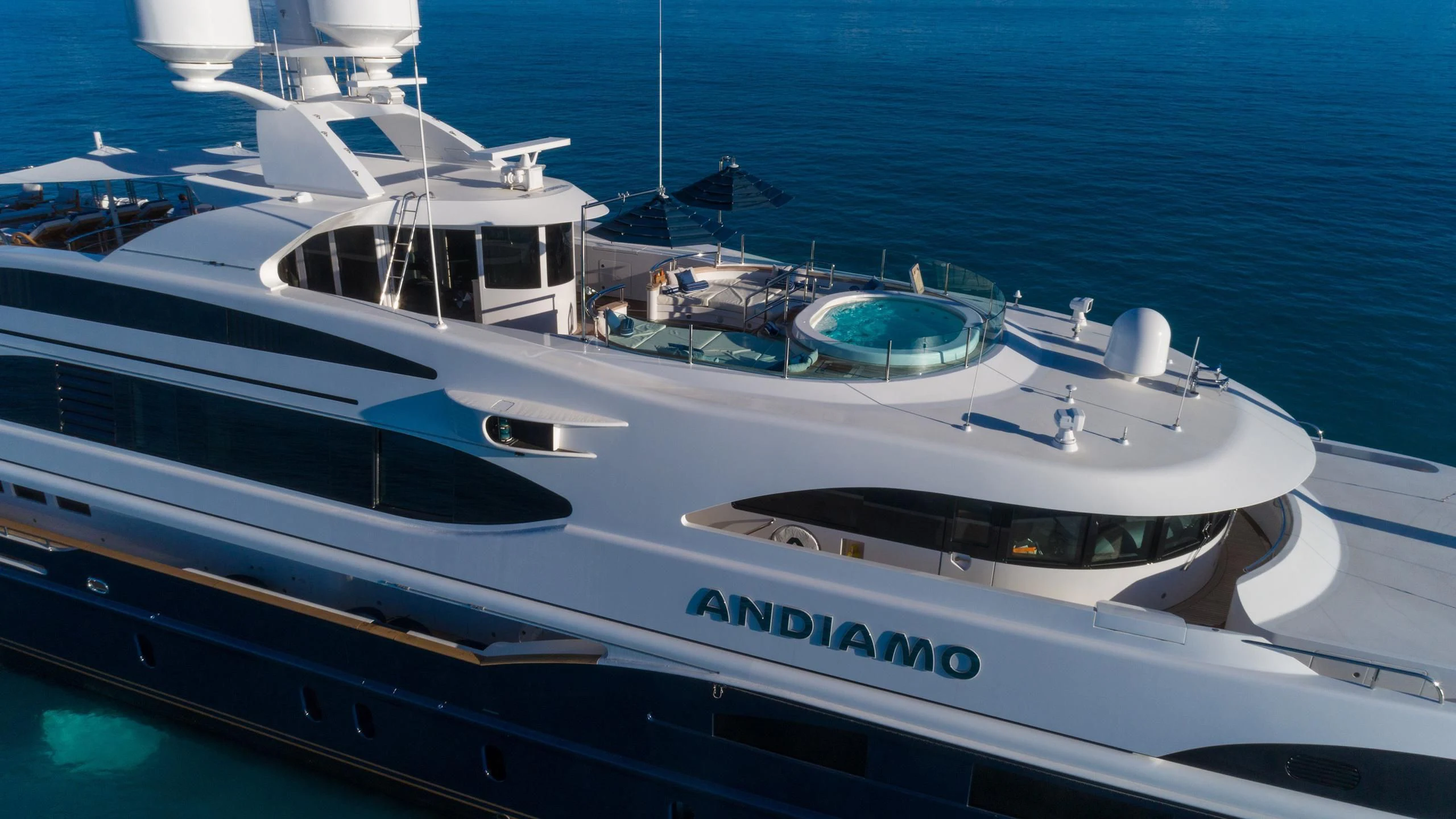 a white yacht in the water aboard ANDIAMO Yacht for Sale