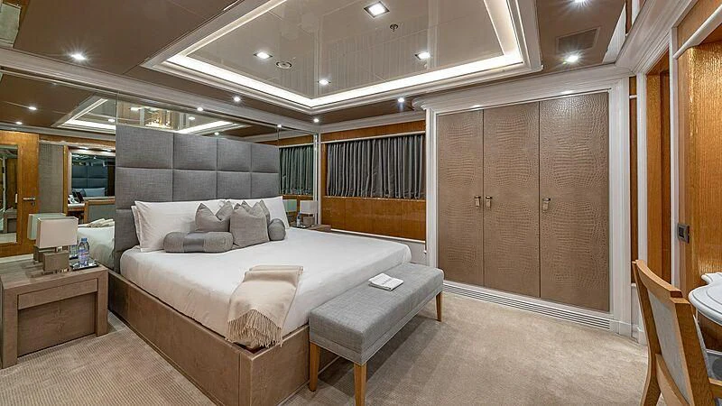 a large bedroom with a bed aboard ANDIAMO Yacht for Sale