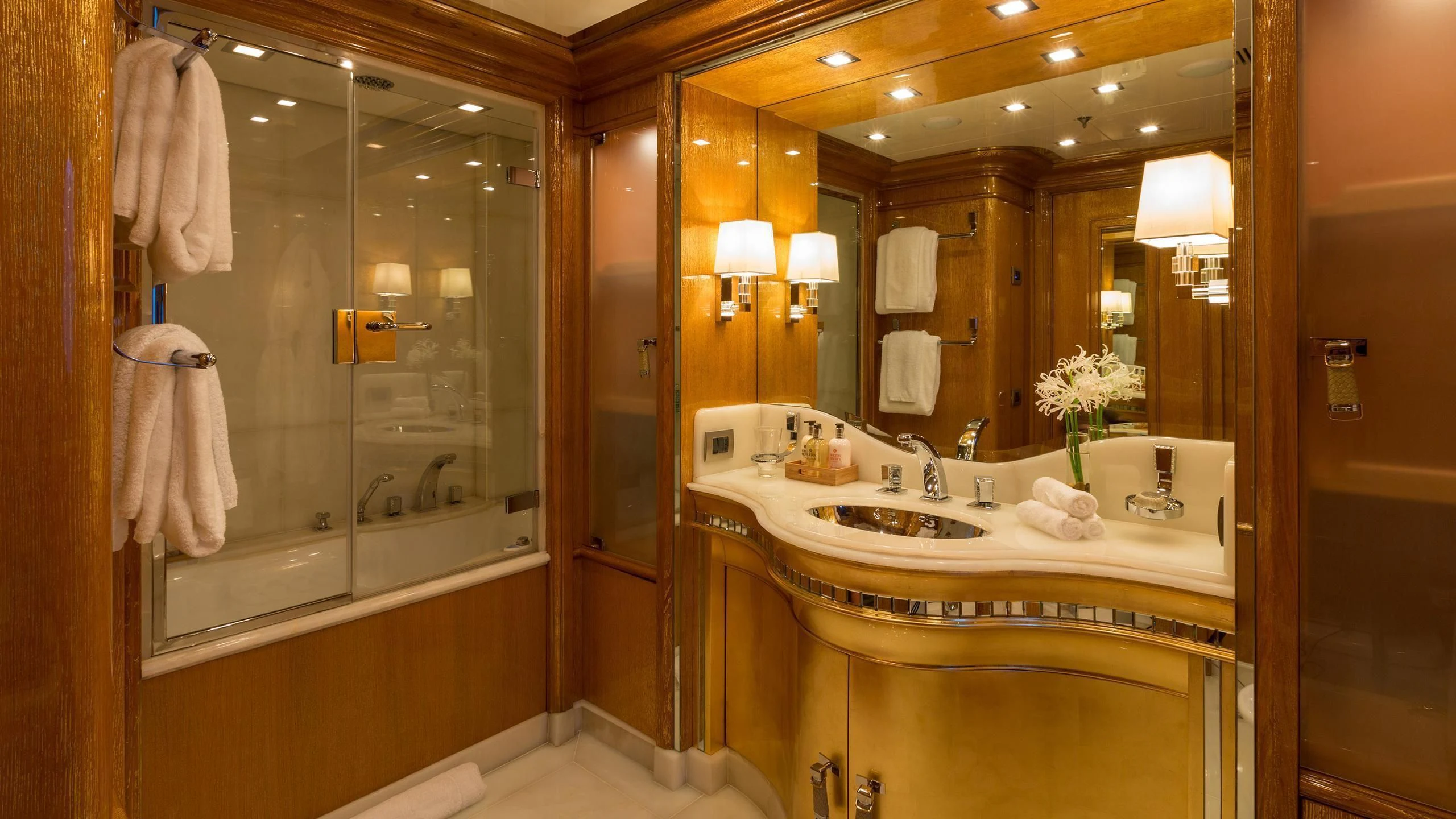 a bathroom with a large glass shower aboard ANDIAMO Yacht for Sale