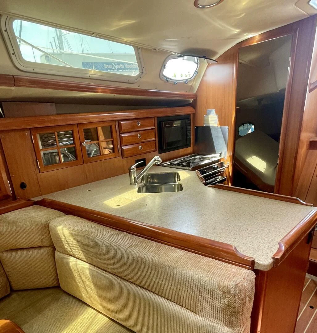 a kitchen with a large island aboard ANDIAMO Yacht for Sale