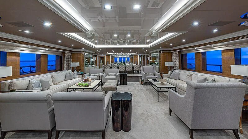 a large room with a couch and a table aboard ANDIAMO Yacht for Sale