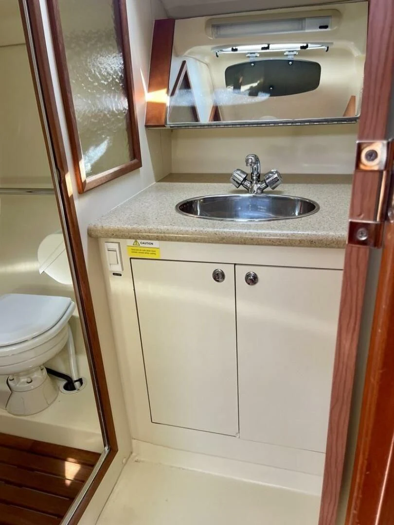 a bathroom with a sink and toilet aboard ANDIAMO Yacht for Sale