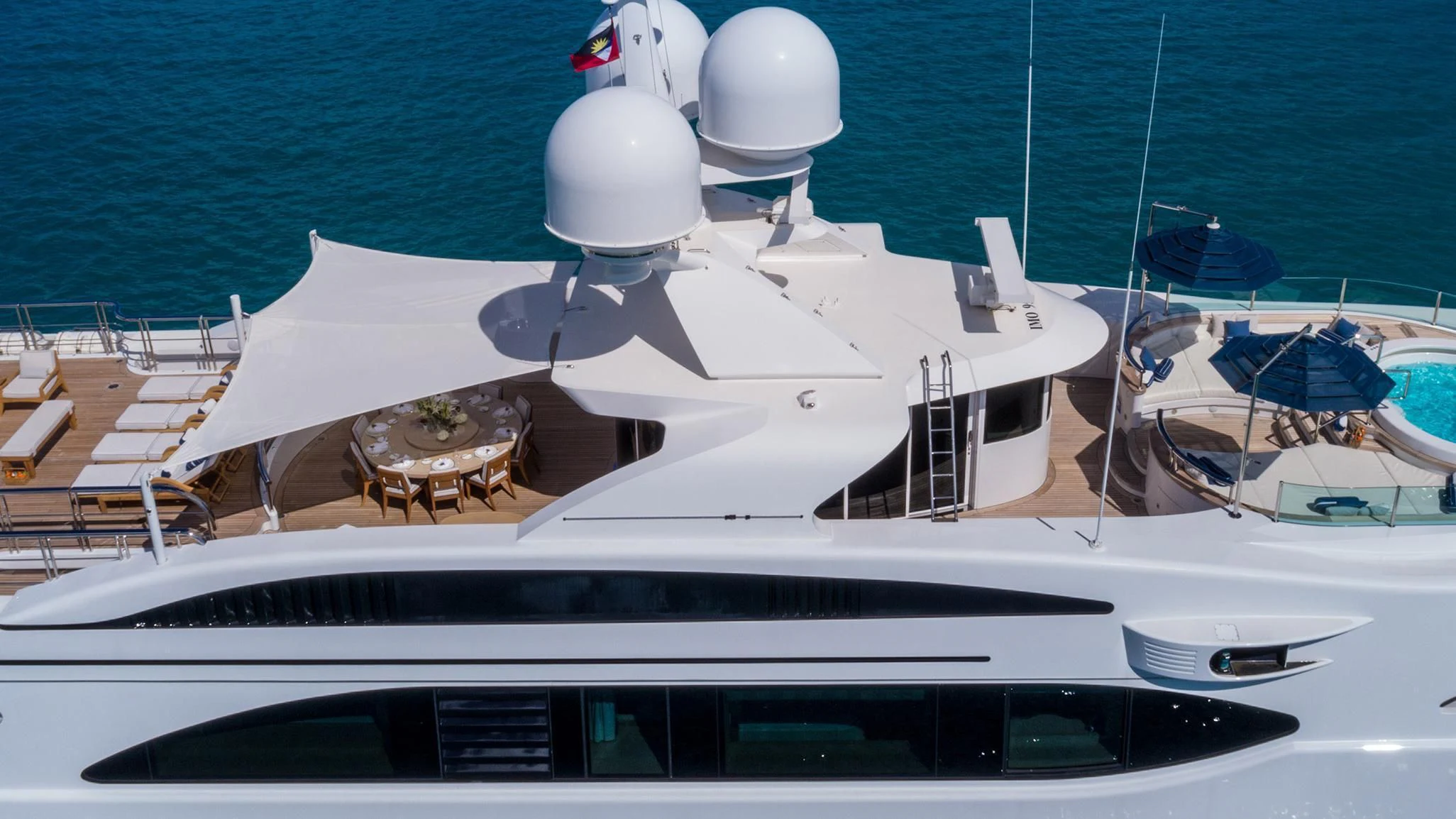 a white yacht on a beach aboard ANDIAMO Yacht for Sale