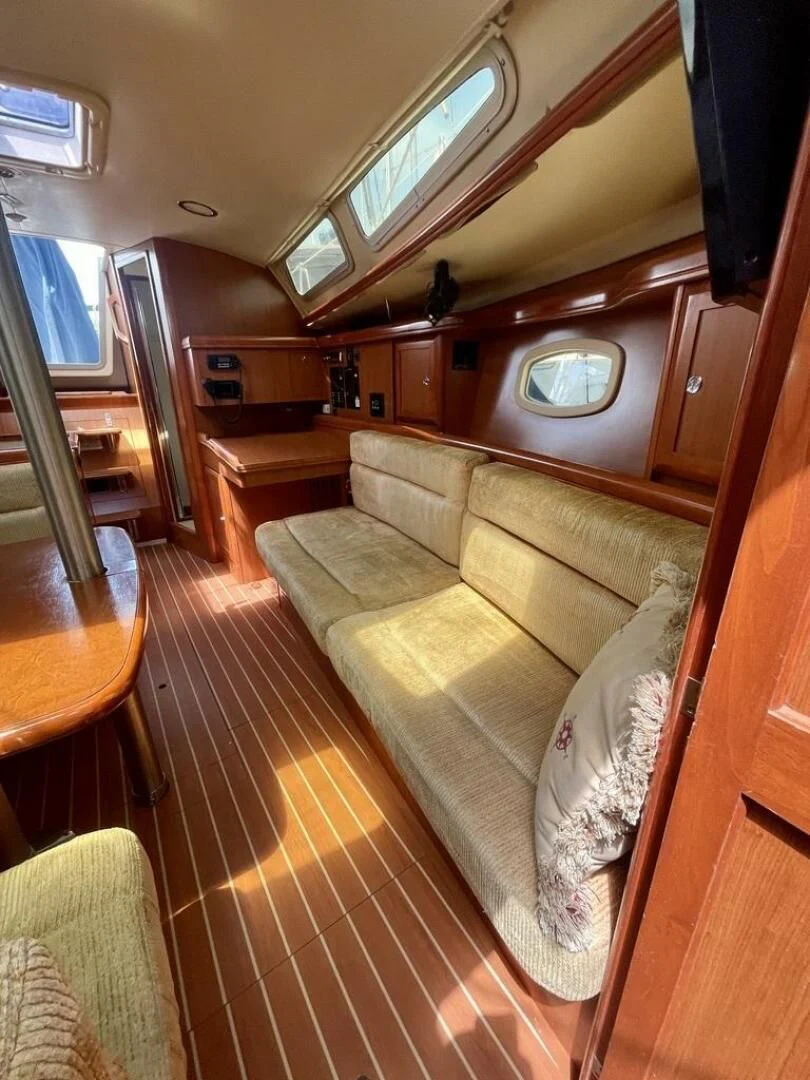 a couch in a room aboard ANDIAMO Yacht for Sale