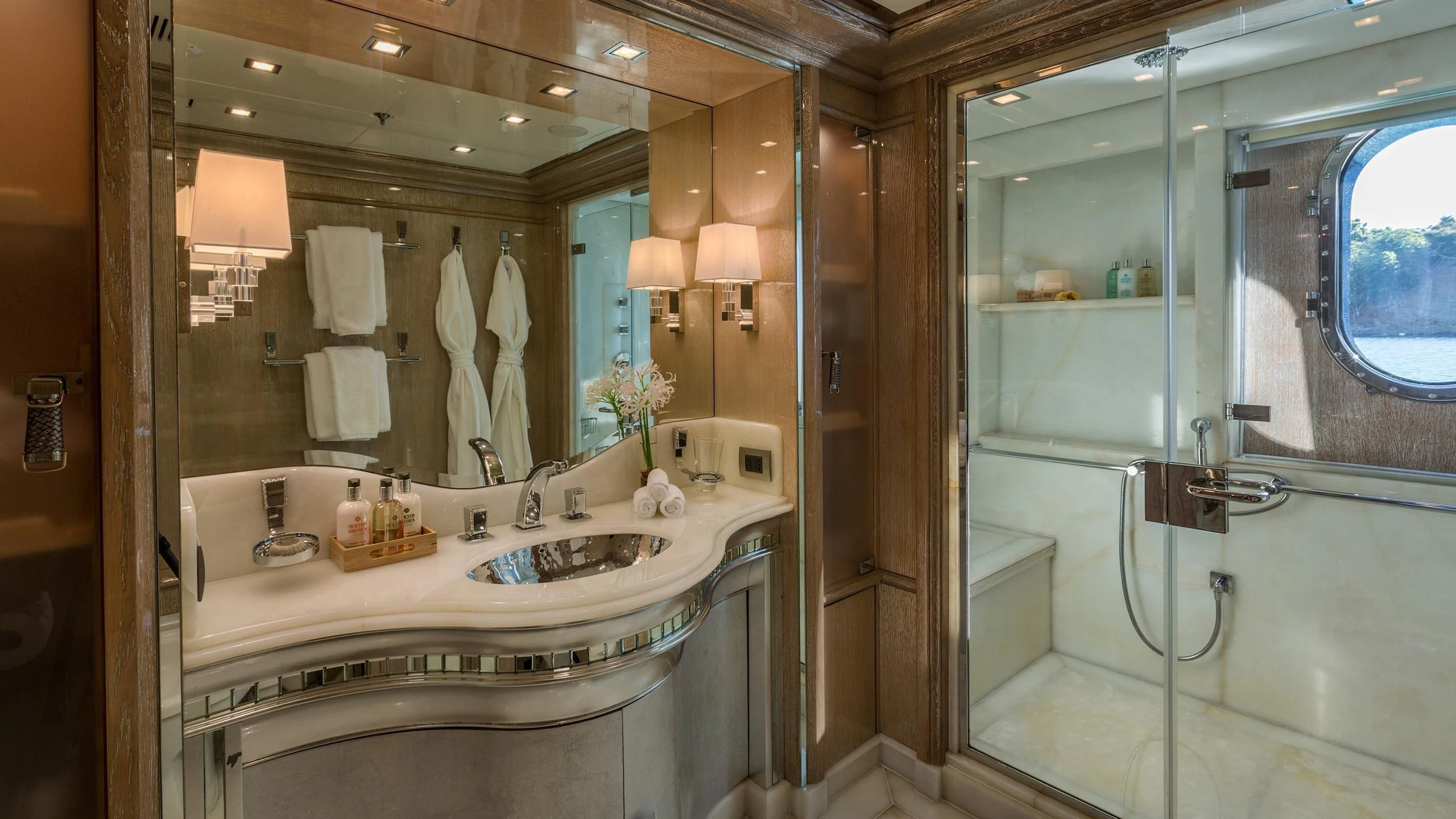 a bathroom with a large mirror aboard ANDIAMO Yacht for Sale