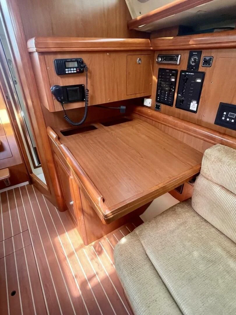 a wood table in a room aboard ANDIAMO Yacht for Sale