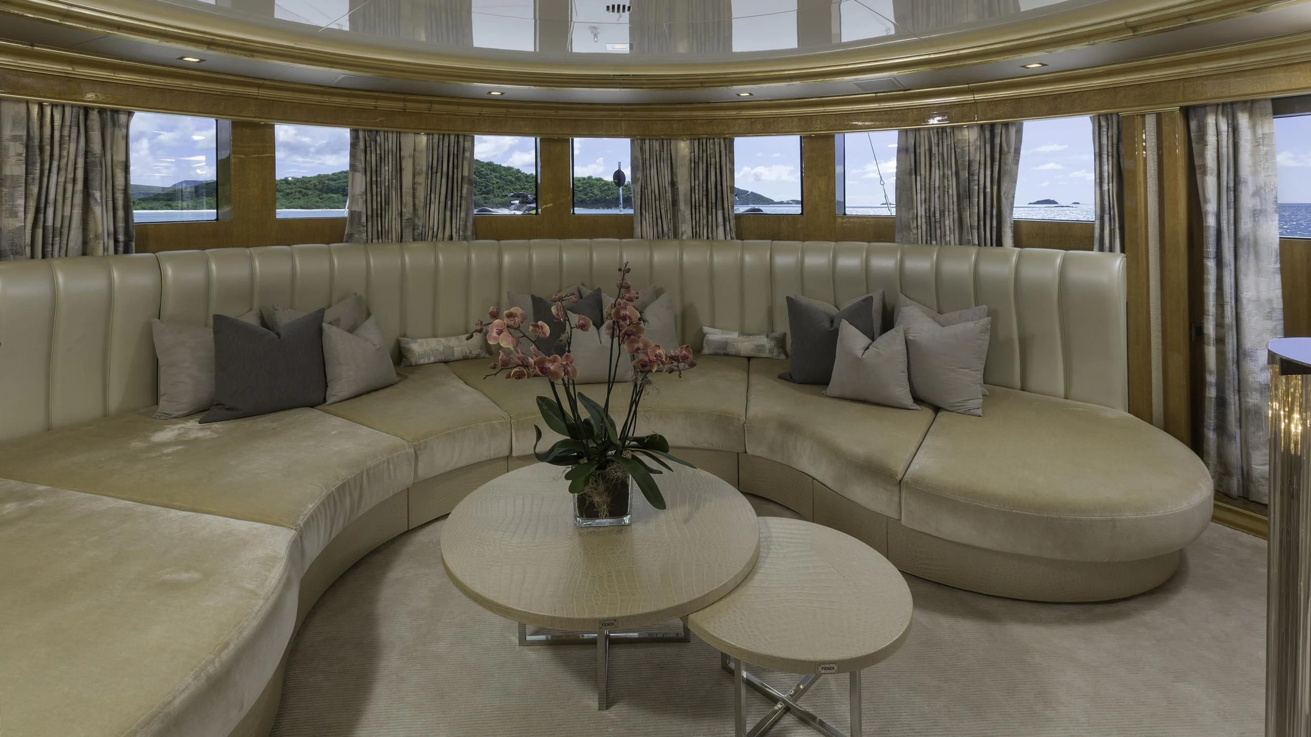 a living room with a couch and coffee table aboard ANDIAMO Yacht for Sale