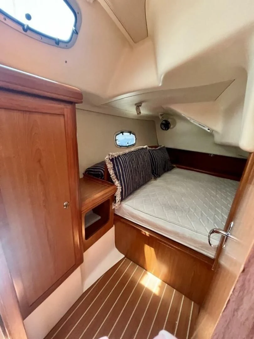 a bed in a room aboard ANDIAMO Yacht for Sale