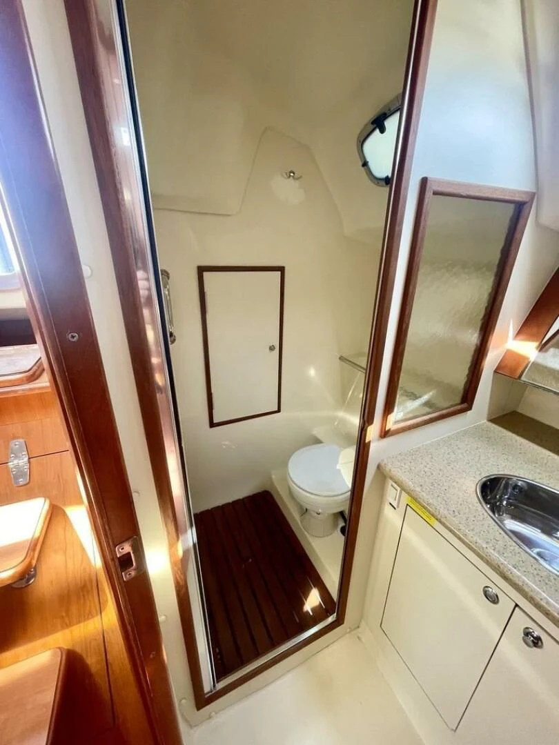 a bathroom with a sink and a toilet aboard ANDIAMO Yacht for Sale