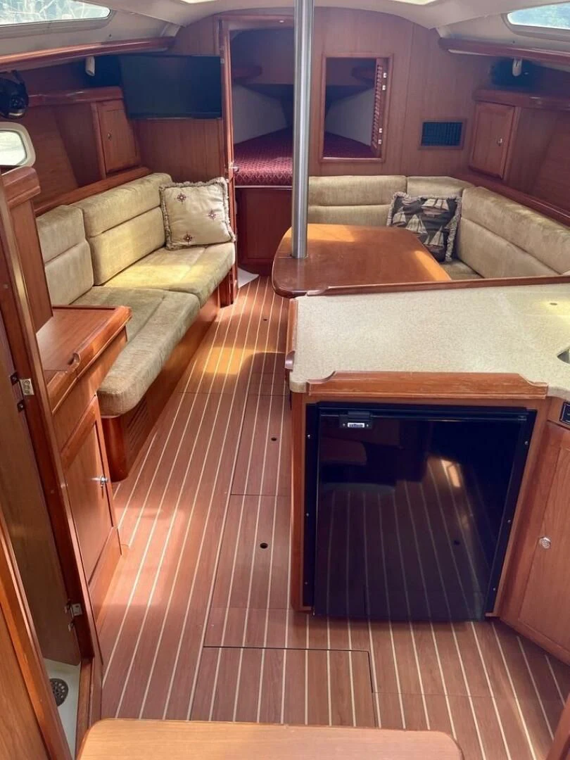 a kitchen with a couch and a sink aboard ANDIAMO Yacht for Sale
