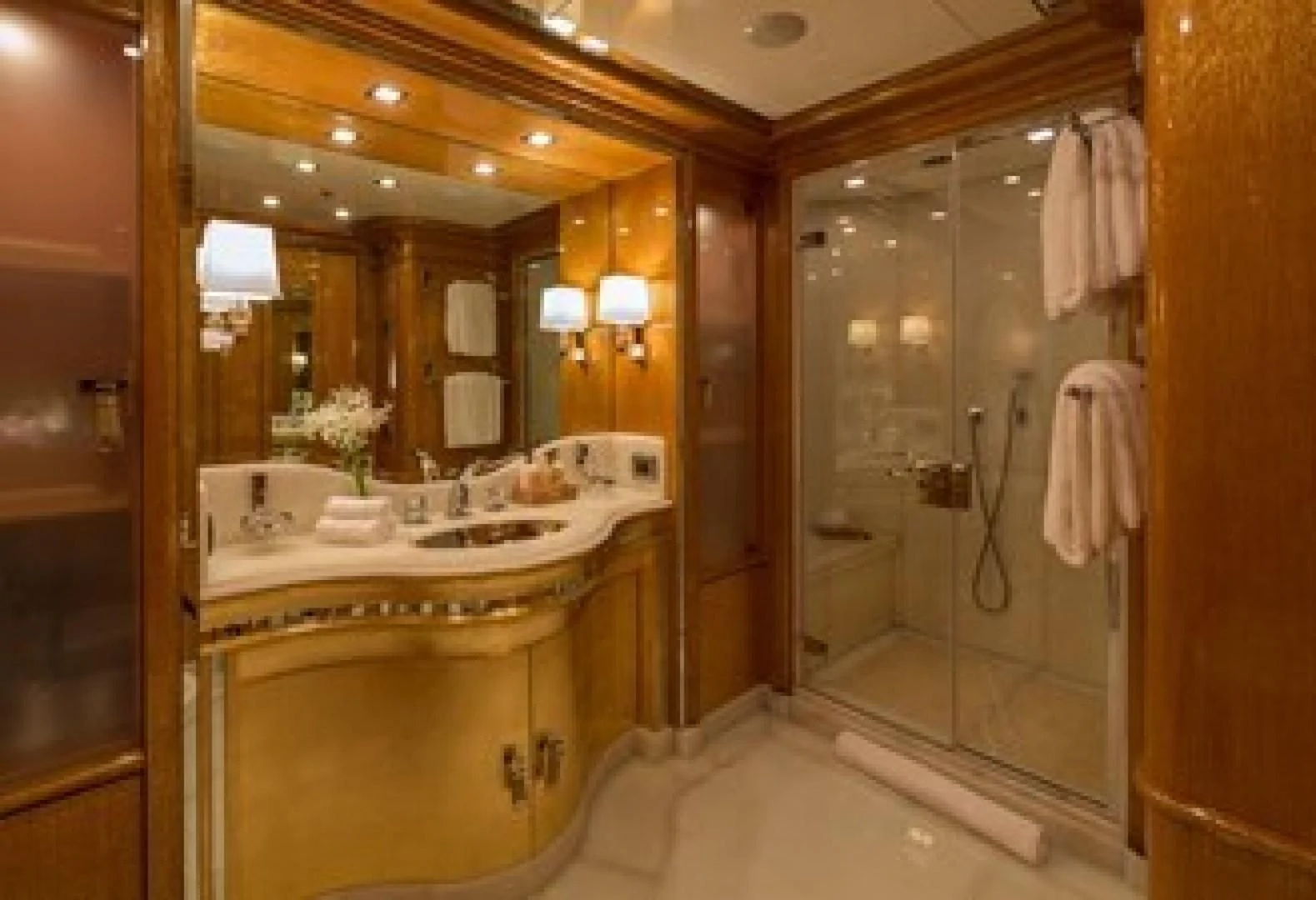 a bathroom with a large mirror aboard ANDIAMO Yacht for Sale