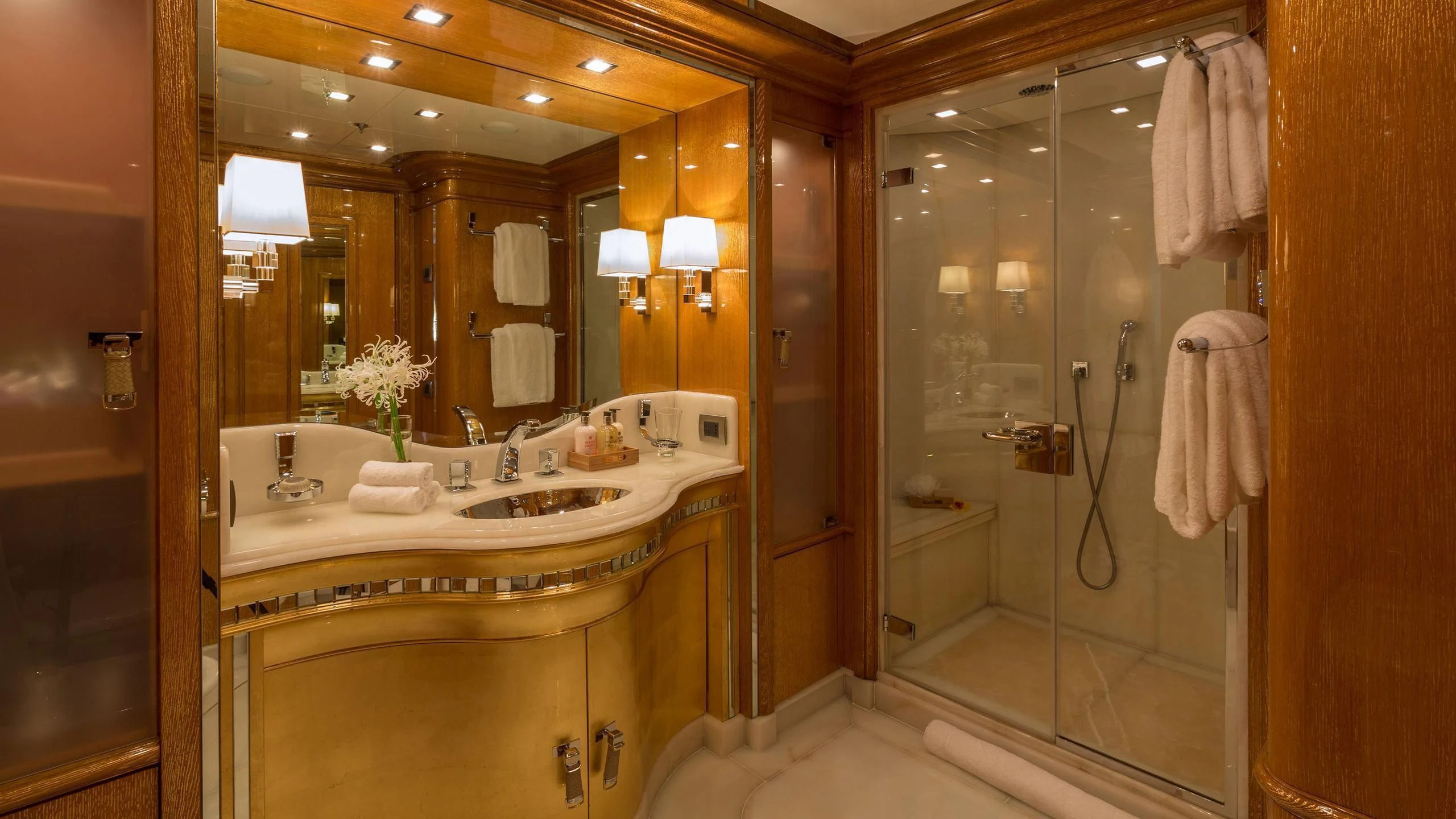 a bathroom with a large mirror aboard ANDIAMO Yacht for Sale