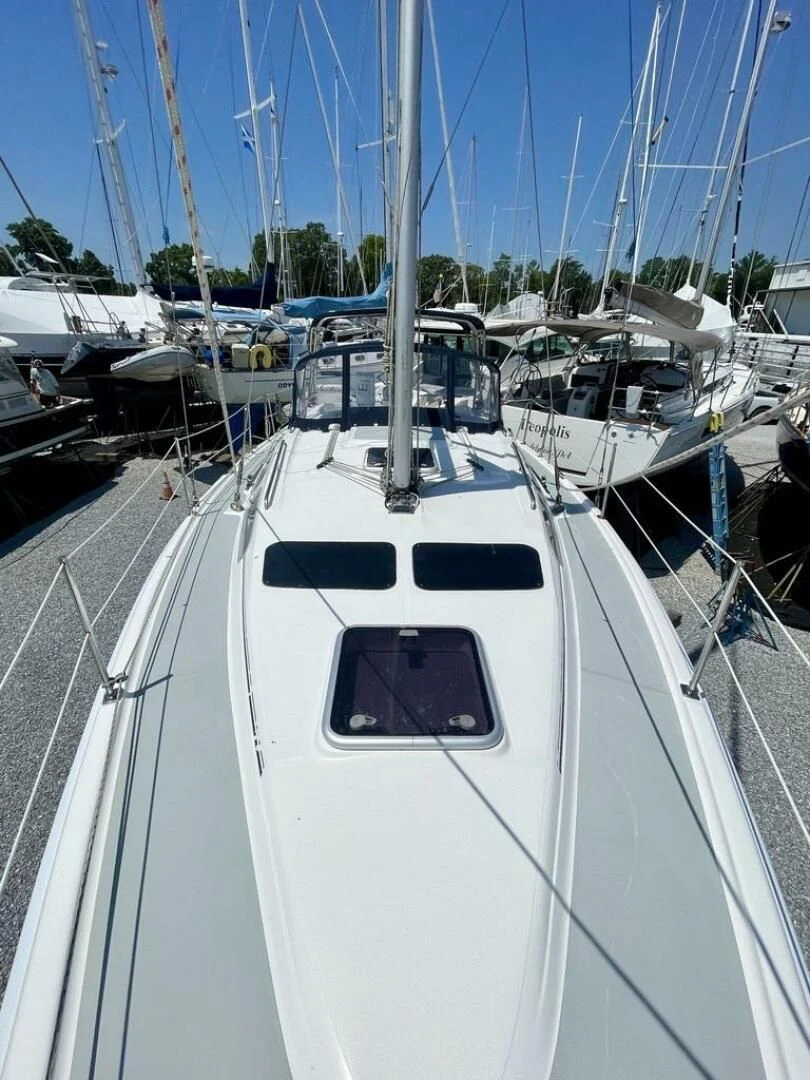 a white boat in a harbor aboard ANDIAMO Yacht for Sale