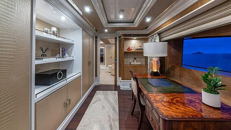 a large kitchen with a table and chairs aboard ANDIAMO Yacht for Sale