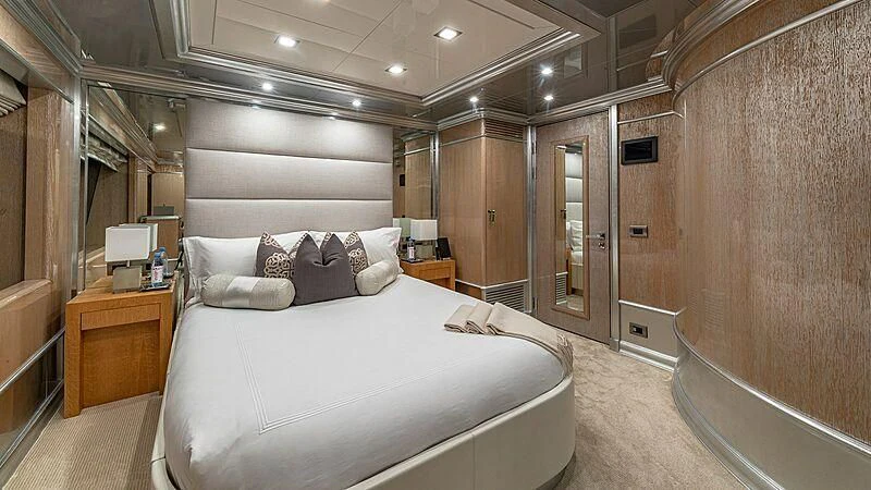 a large bedroom with a bed aboard ANDIAMO Yacht for Sale