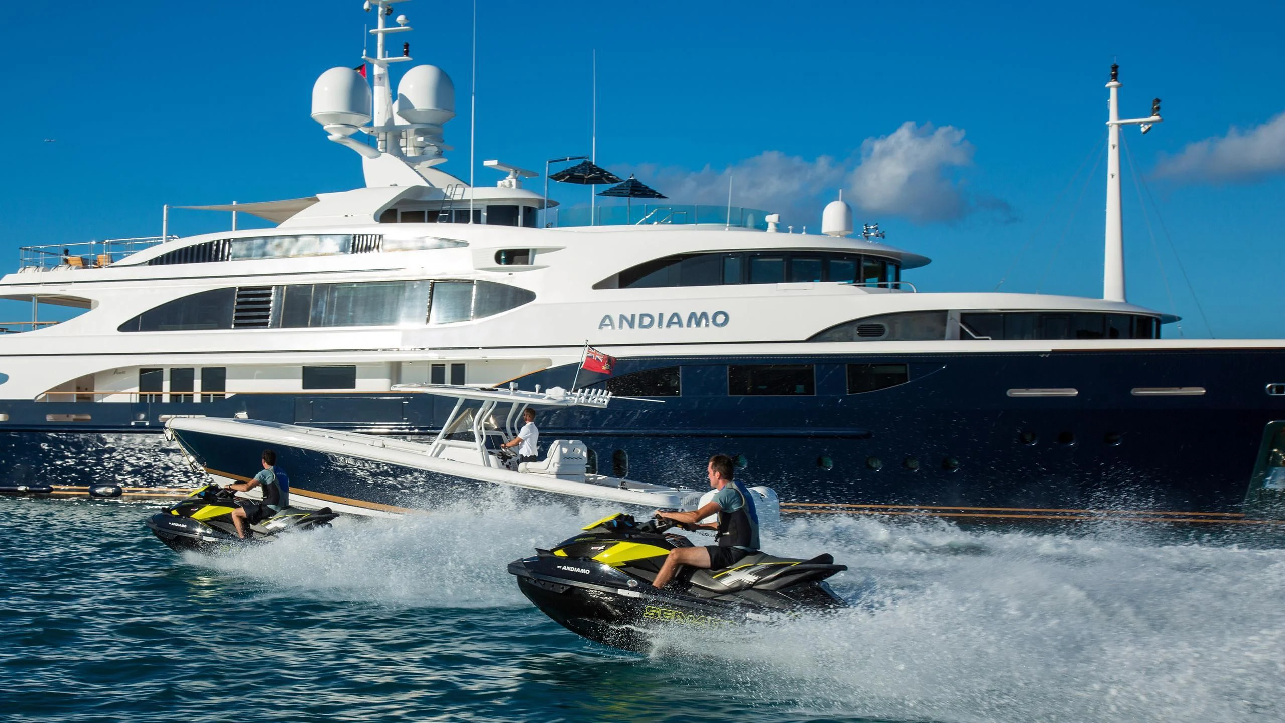 a boat with a person on it and a boat in the water aboard ANDIAMO Yacht for Sale