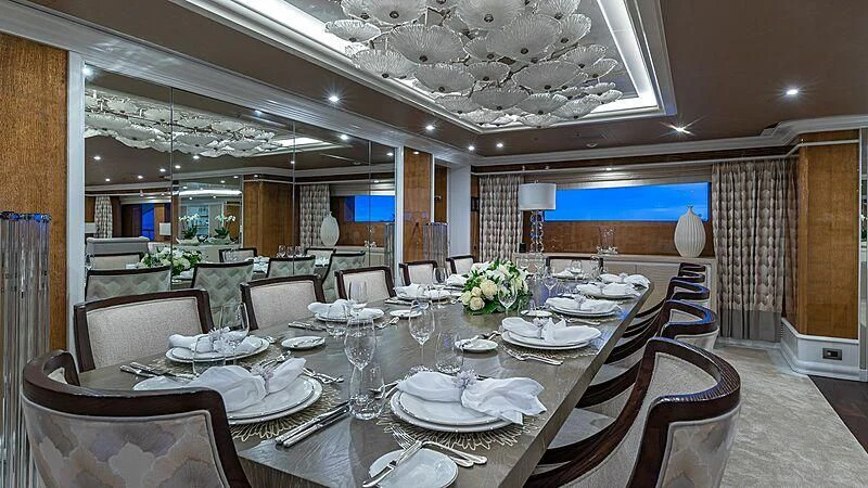 a large dining room with tables and chairs aboard ANDIAMO Yacht for Sale