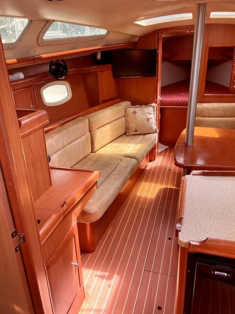 a room with a couch and a table aboard ANDIAMO Yacht for Sale