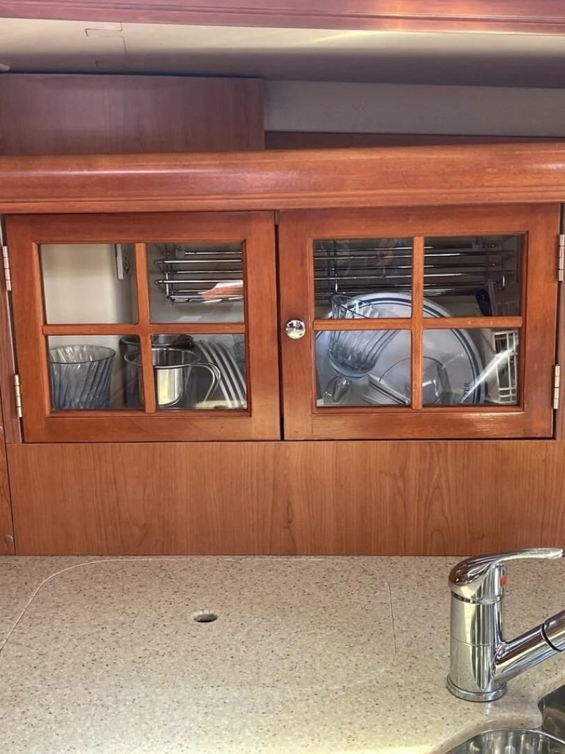 a kitchen with a glass window aboard ANDIAMO Yacht for Sale