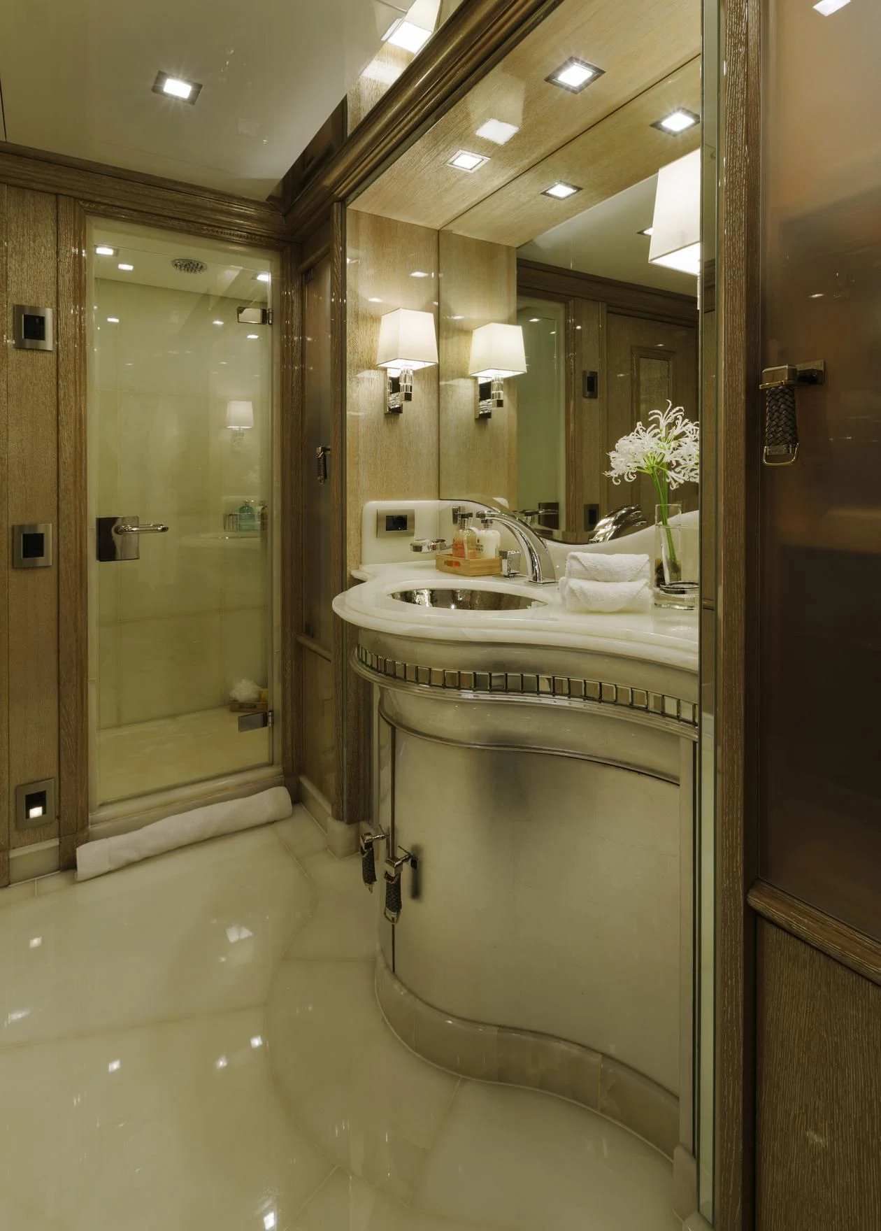 a bathroom with a large mirror aboard ANDIAMO Yacht for Sale