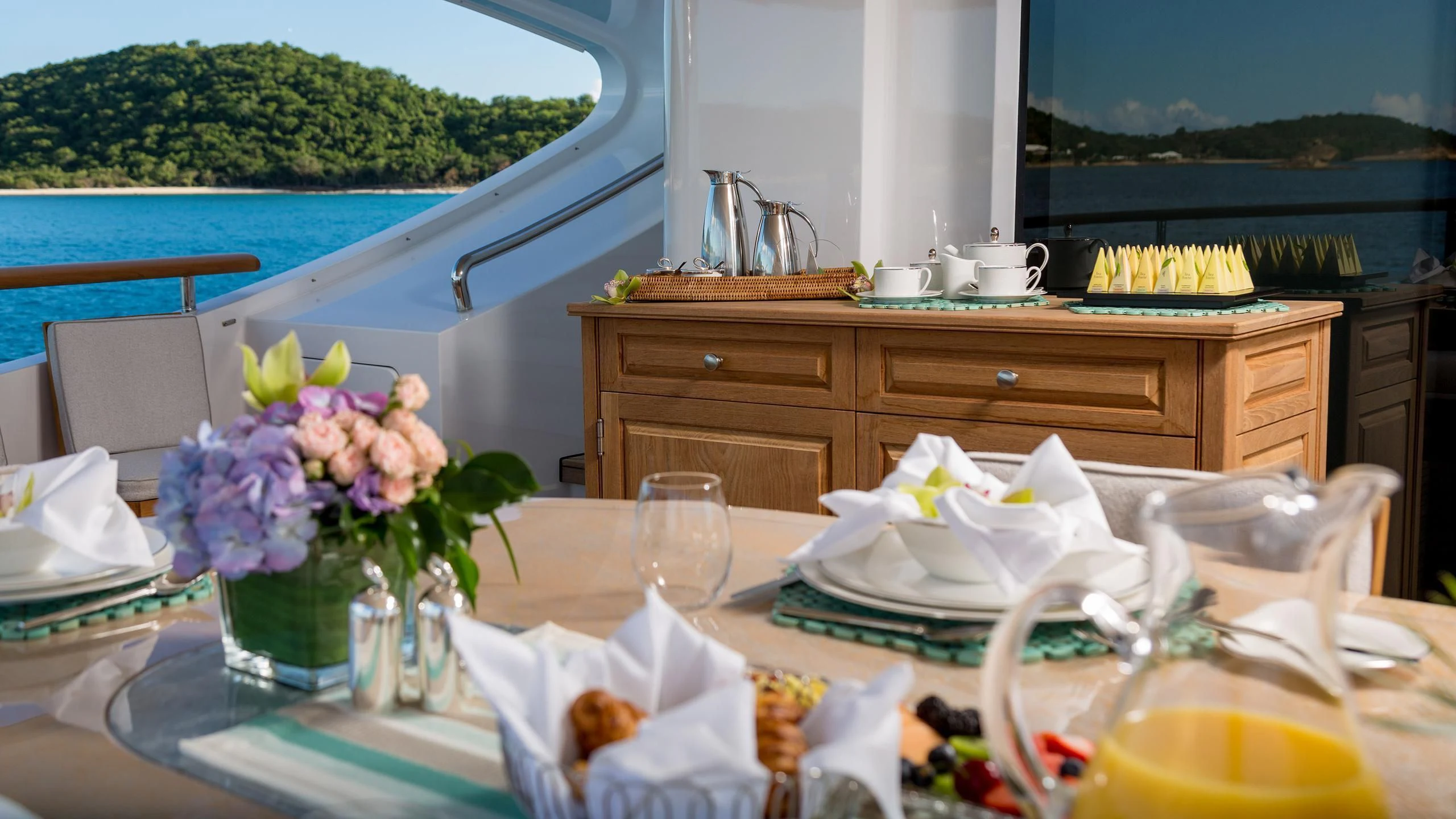 a table with food and drinks aboard ANDIAMO Yacht for Sale