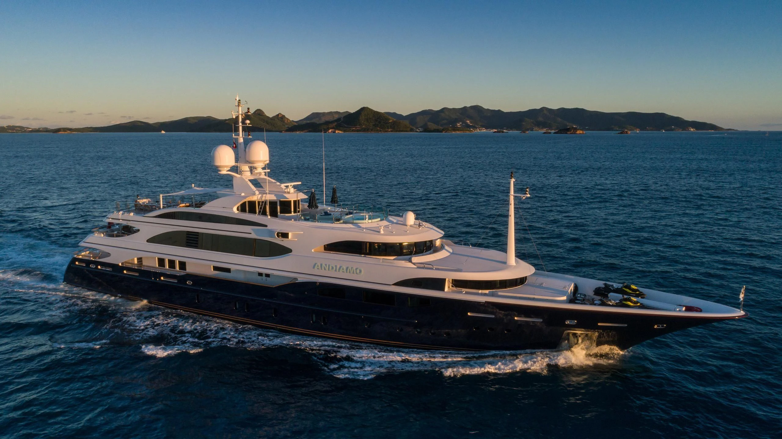 a large boat on the water aboard ANDIAMO Yacht for Sale