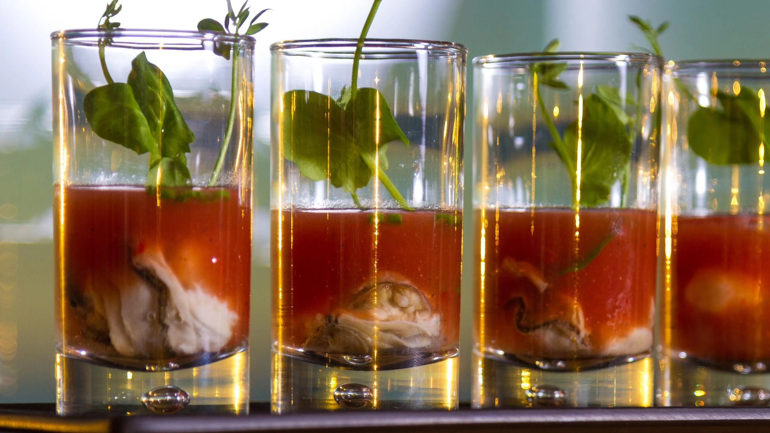 a group of glasses with liquid in them aboard ANDIAMO Yacht for Sale