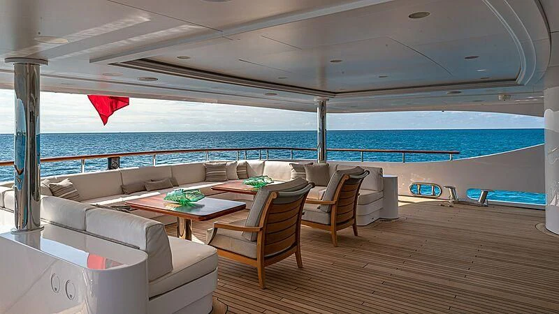 a living room with a large blue ocean aboard ANDIAMO Yacht for Sale