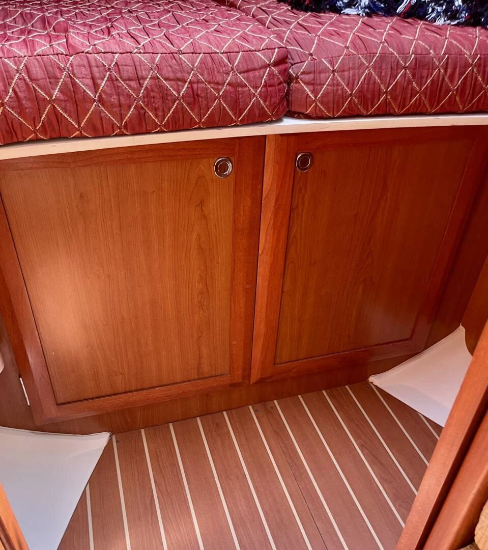 a wooden cabinet with drawers aboard ANDIAMO Yacht for Sale