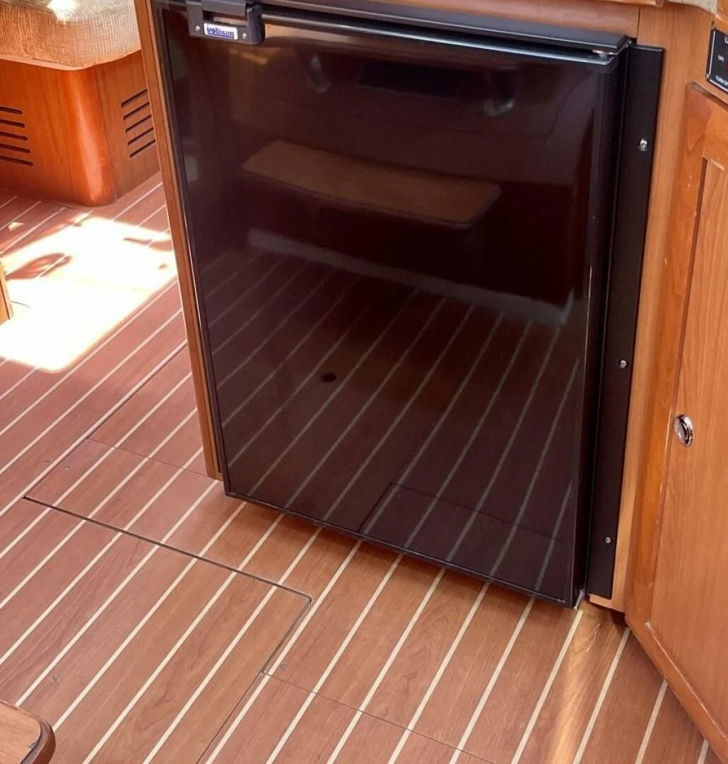 a kitchen with a wood floor aboard ANDIAMO Yacht for Sale
