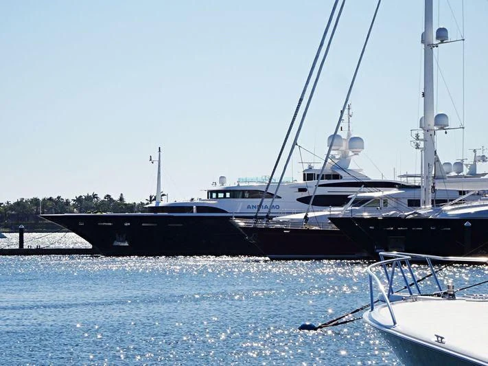 a couple of boats are parked in the water aboard ANDIAMO Yacht for Sale