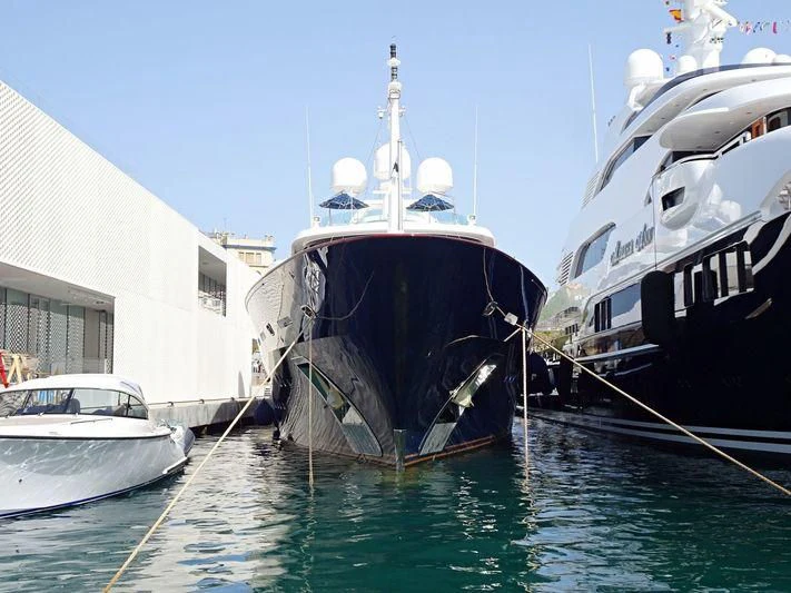 a couple of boats sit in a harbor aboard ANDIAMO Yacht for Sale