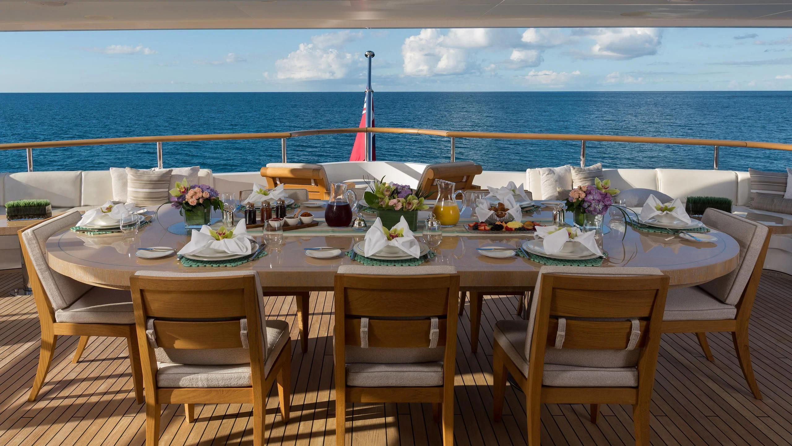 a table set for a dinner party aboard ANDIAMO Yacht for Sale