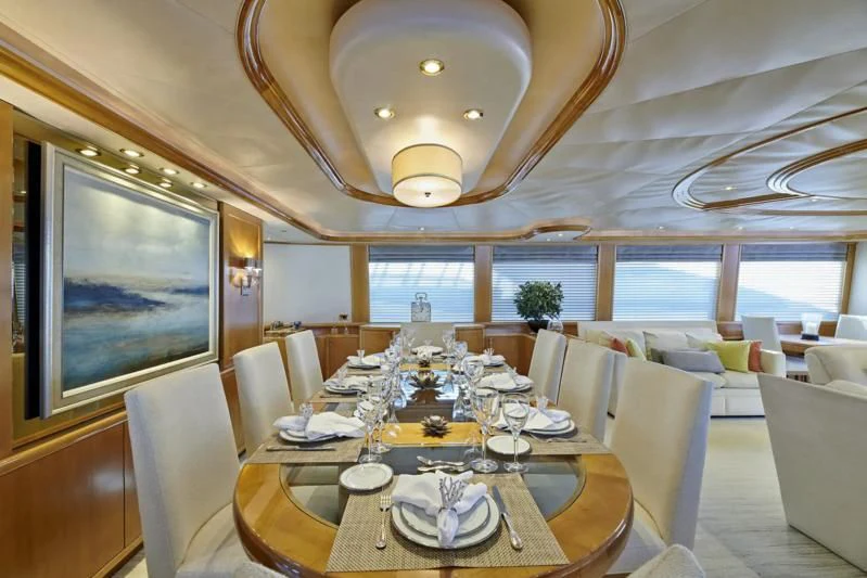 a dining room with a large table aboard HATATY Yacht for Sale