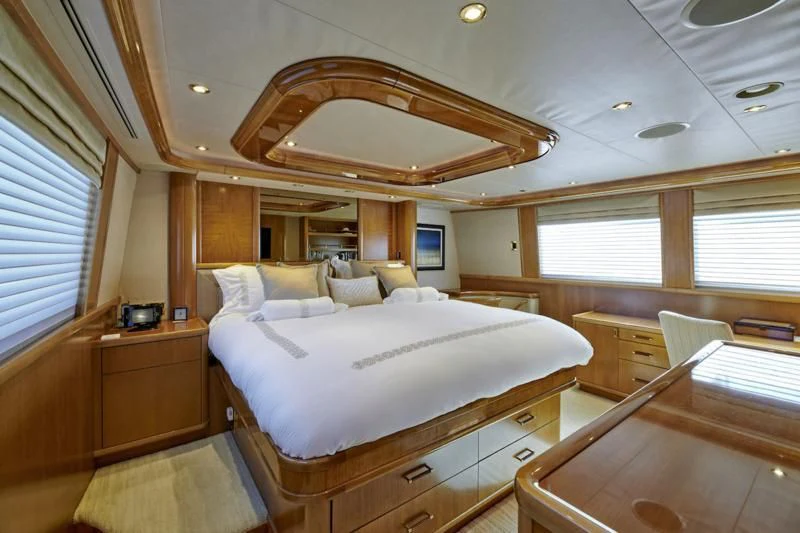 a large bedroom with a large bed aboard HATATY Yacht for Sale