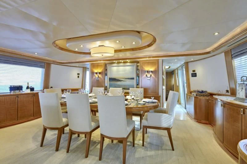 a large kitchen with a dining table aboard HATATY Yacht for Sale