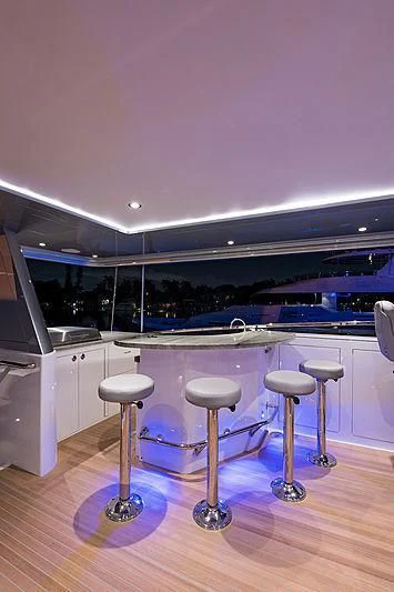 a couple stools in a room aboard HAT TRICK Yacht for Sale