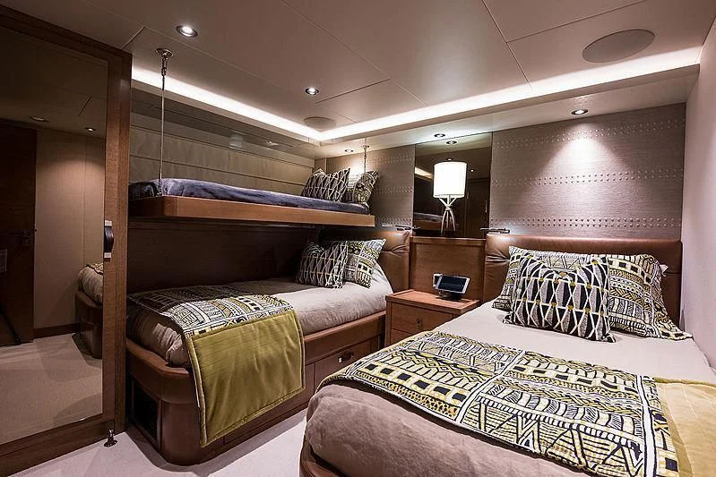 a couple of beds in a hotel room aboard HAT TRICK Yacht for Sale