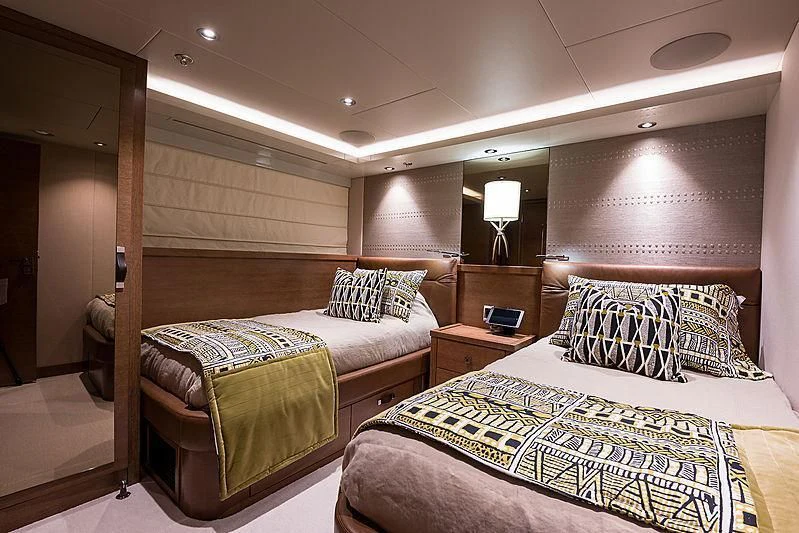 a couple of beds in a hotel room aboard HAT TRICK Yacht for Sale