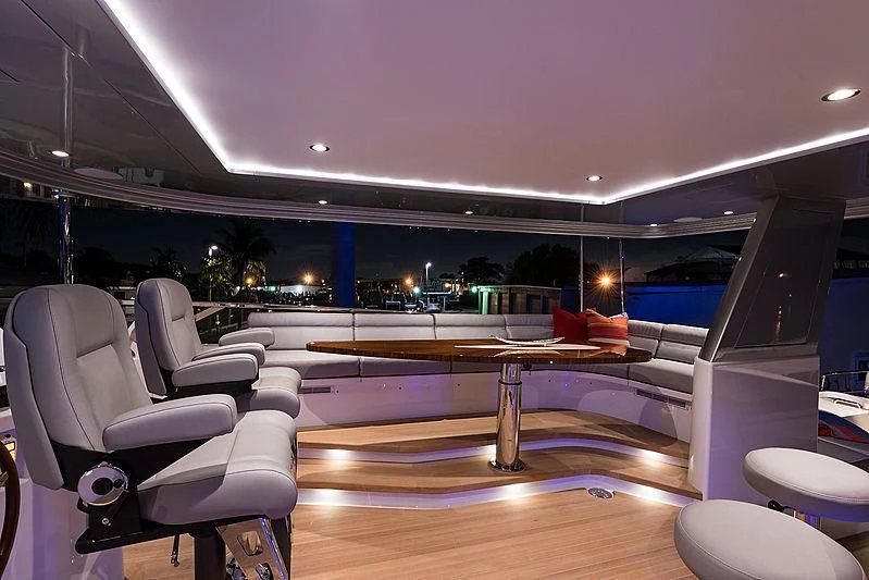 a swimming pool with a deck and chairs aboard HAT TRICK Yacht for Sale