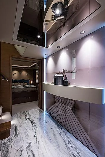 a room with a bed and a mirror aboard HAT TRICK Yacht for Sale