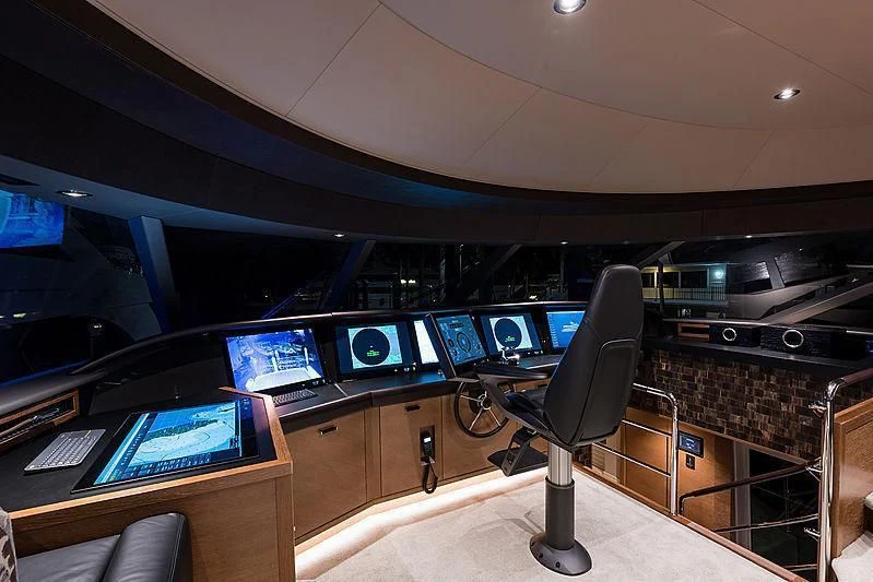 a room with computers and monitors aboard HAT TRICK Yacht for Sale