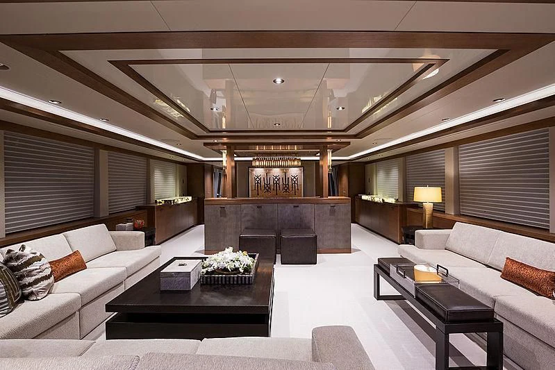 a living room with a fireplace aboard HAT TRICK Yacht for Sale