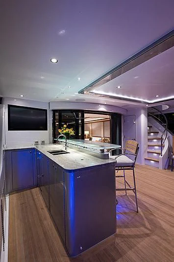 a kitchen with a large island aboard HAT TRICK Yacht for Sale
