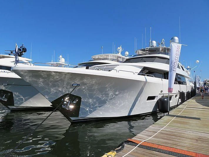 a boat docked at a pier aboard HAT TRICK Yacht for Sale