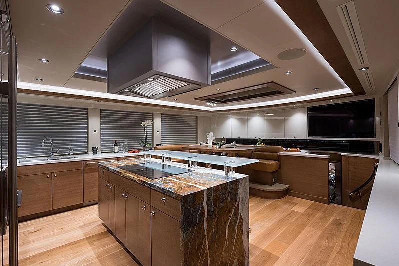 a large kitchen with a large island aboard HAT TRICK Yacht for Sale