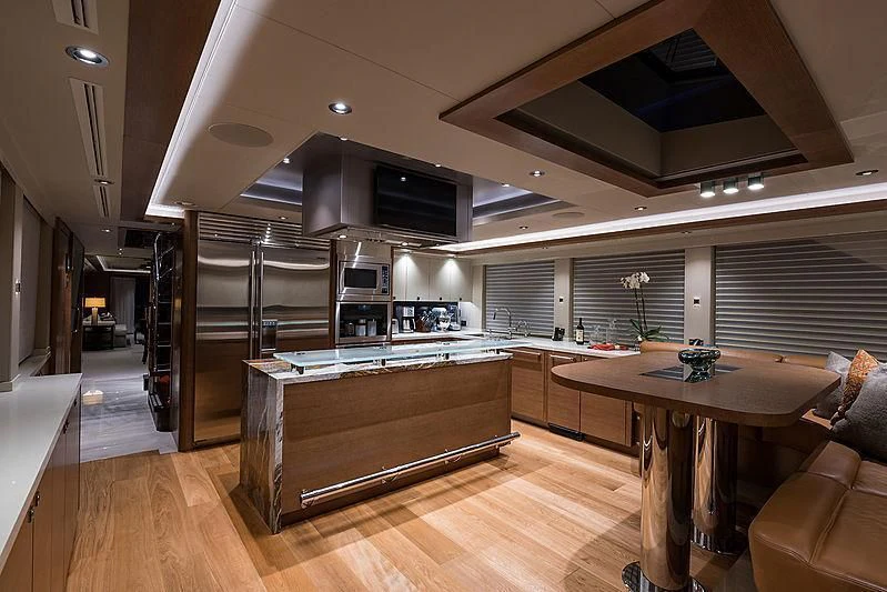 a large kitchen with a large island aboard HAT TRICK Yacht for Sale