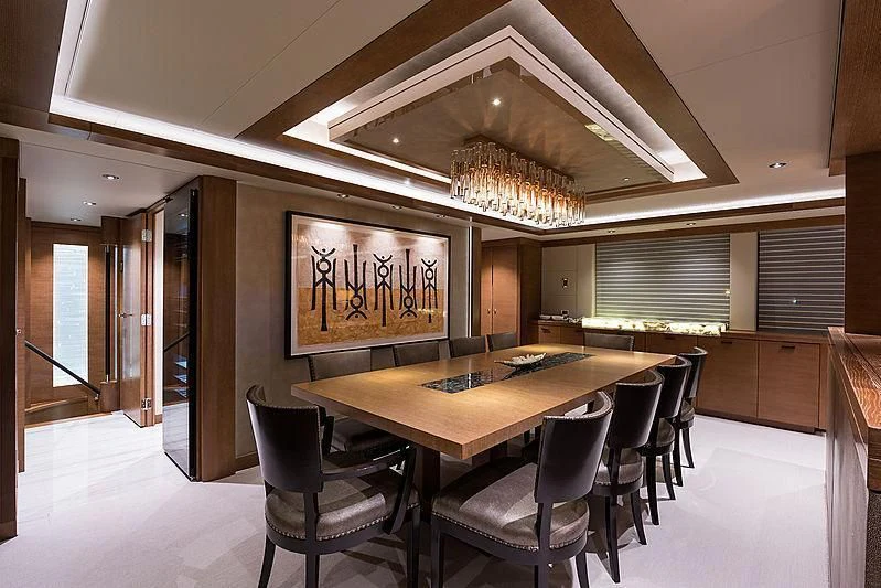 a large dining table in a room aboard HAT TRICK Yacht for Sale